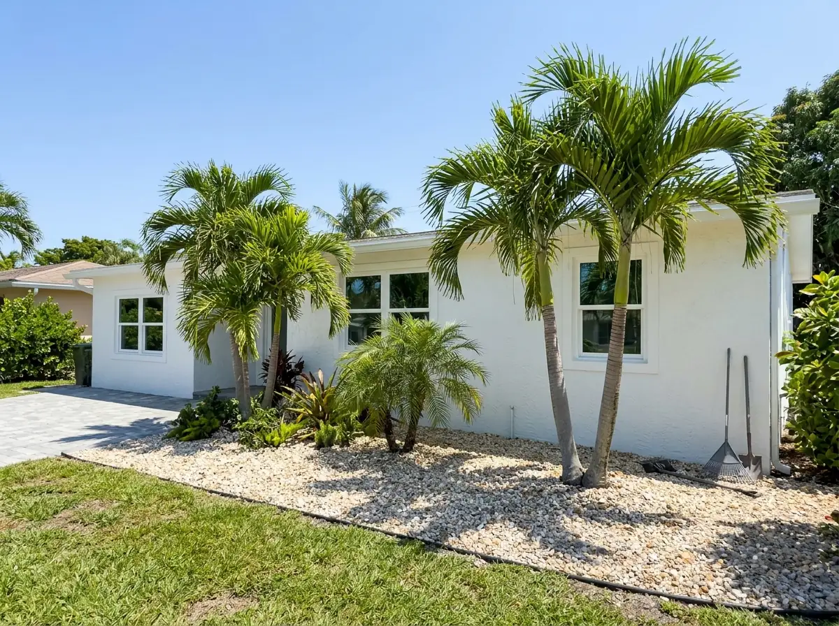 White aluminum impact windows on a single-story stucco house